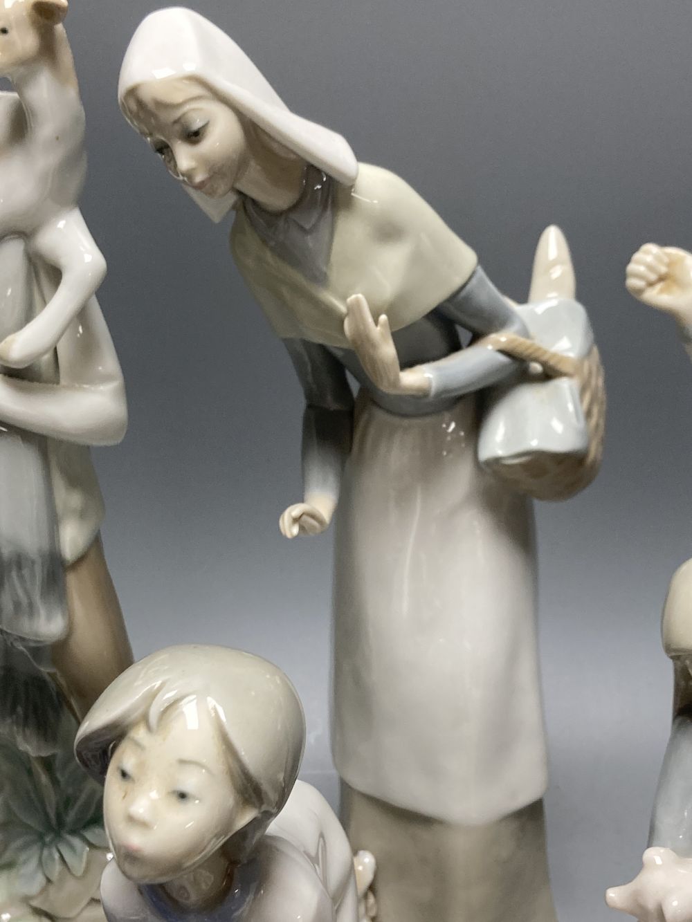 A collection of Lladro and Goebel porcelain figures and other items